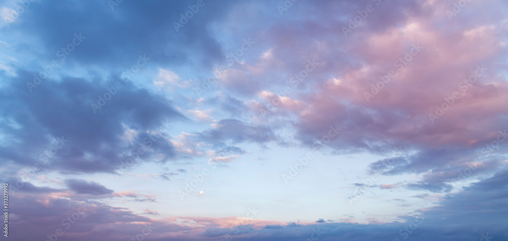 Beautiful full moon on the sunrise sky. Astronomical background.