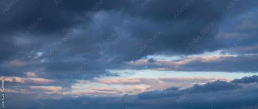 Beautiful full moon on the sunrise sky. Astronomical background. Beautiful full moon on the sunrise sky. Astronomical background.