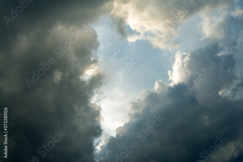 Heart-shaped cloud on a blue and dark sky.