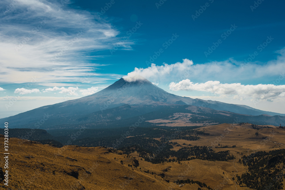 View of the popopocatepetl volcano on the slopes of iztaccihuatl