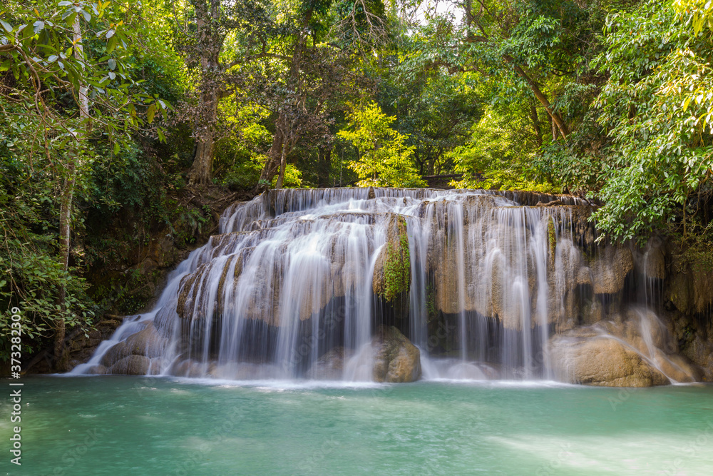 Long exposure short of Erawan waterfalll, a beautiful tropical waterfall in Thailland