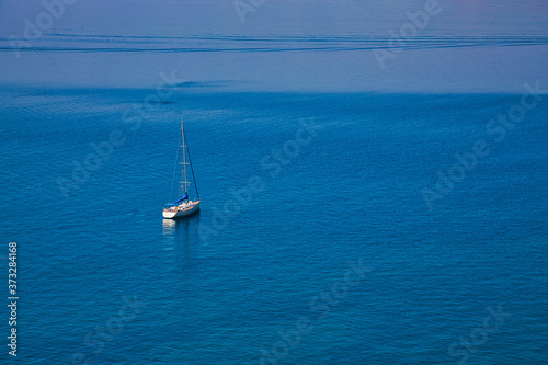 Yacht in the Mediterranean sea on blue background