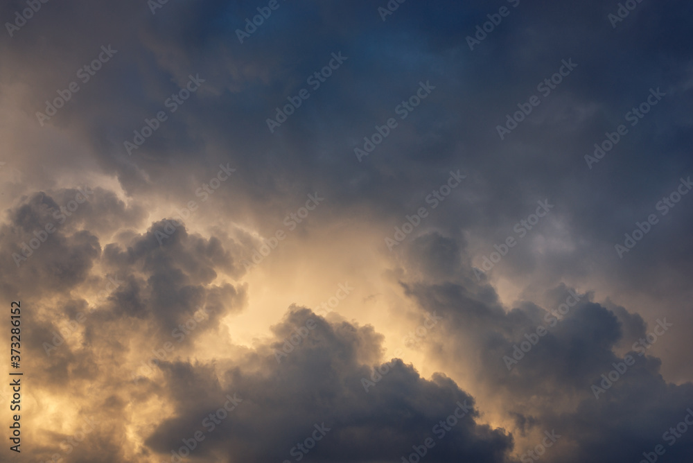 Dramatic dark rainy clouds hiding sun in the evening before the hurricane Dramatic dark rainy clouds hiding sun in the evening before the hurricane