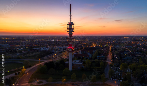 Antenna tower in city sunset