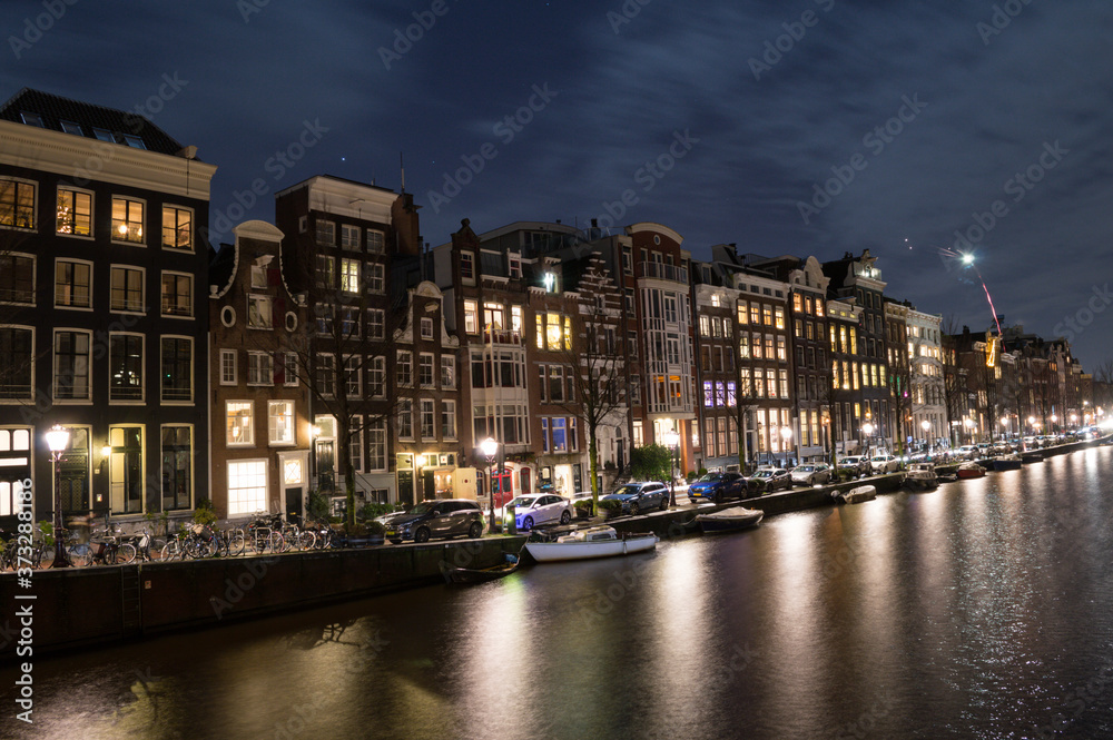 Traditional Dutch Canal Houses during New Year’s Eve in Amsterdam, Netherlands