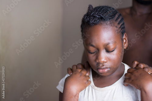 A young African child being abused  photo