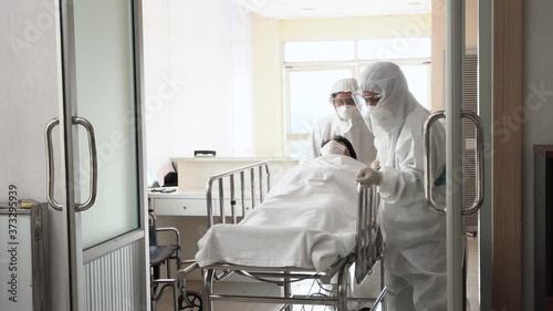 Doctor in PPE suit,face mask,glove take Covid 19 patient to swab test