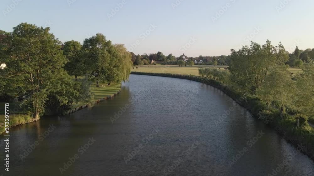 River with trees and fields and a river bend in Belgium River with trees and fields and a river bend in Belgium
