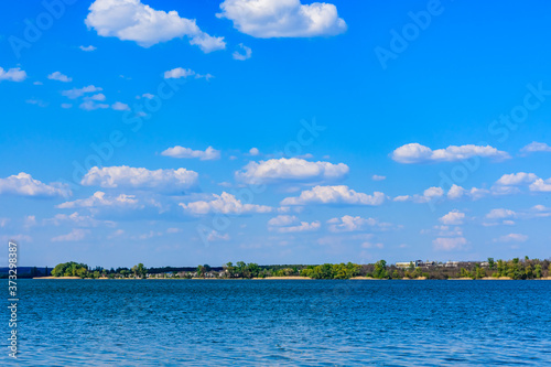 Summer landscape with the green trees and lake. Kremenchug reservoir photo