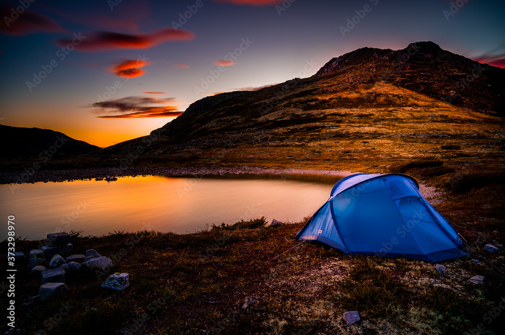 tent at sunset in rondane national park, Norway