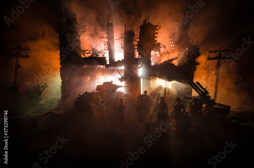 War Concept. Military silhouettes fighting scene on war fog sky background, World War Soldiers Silhouette Below Cloudy Skyline At night.