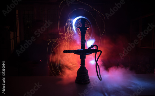 Hookah hot coals on shisha bowl with black background. Stylish oriental shisha. Shisha Concept