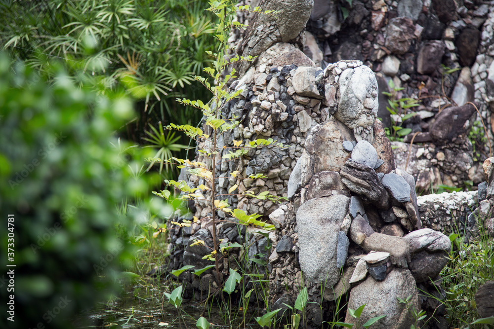 fantastic stone arranging as human shape on sitting action