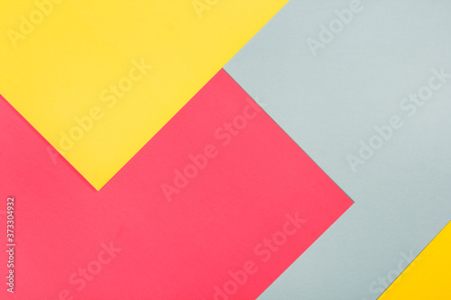 geometric flat lay composition of bright colored paper