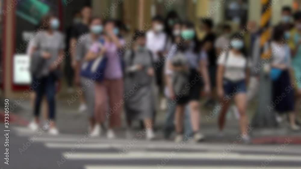 Slow motion of blurred defocused view of coronavirus epidemic in China concept. People wearing face masks againt coronavirus. Asian pedestrian with medical mask crossing road city. Unfocused -Dan Slow motion of blurred defocused view of coronavirus epidemic in China concept. People wearing face masks againt coronavirus. Asian pedestrian with medical mask crossing road city. Unfocused -Dan