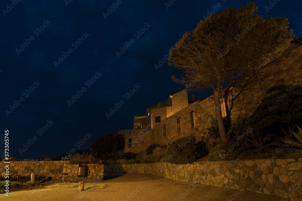 Fototapeta premium Old builing by night in Algajola,Corse