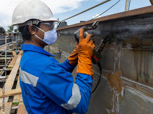 Checking defect in welded with process Magnetic Particle Testing(MT) of Non-Destructive Testing(NDT) at industrial factory.