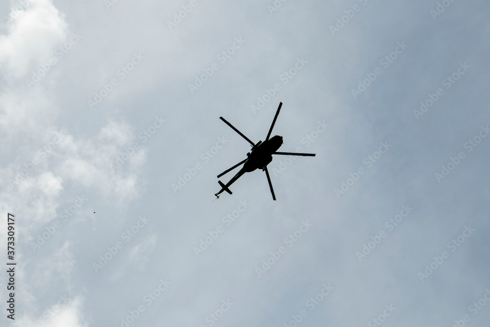 helicopter against the blue sky helicopter against the blue sky
