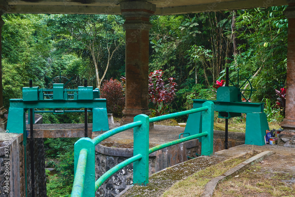 Photo of an old water dam for water supply to rice fields under a stone roof Photo of an old water dam for water supply to rice fields under a stone roof
