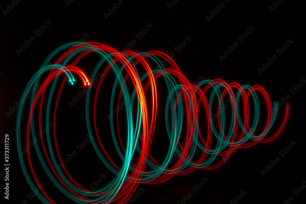 double corkscrew in green and red with black background double corkscrew in green and red with black background