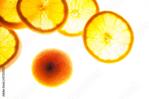 Close up group of orange slices with backlite. macro photo