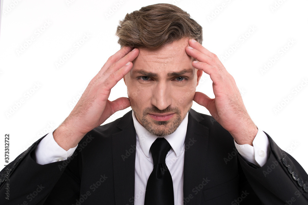 Life problems. Portrait of handsome young man keeping head in hands and looking at camera while standing against white background
Life problems. Portrait of handsome young man keeping head in hands and looking at camera while standing against white background