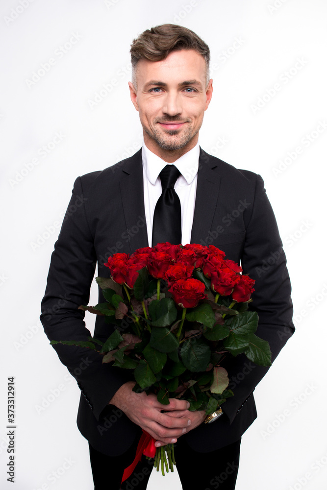 Awesome surprise for you with love. Handsome young man holding roses and looking at camera with smile while standing against white background
Awesome surprise for you with love. Handsome young man holding roses and looking at camera with smile while standing against white background