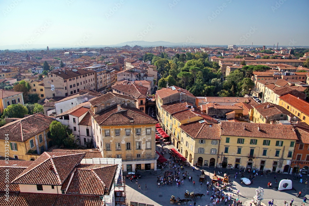 View of the old city from the top of the famous leaning tower in the city of Pisa, Italy