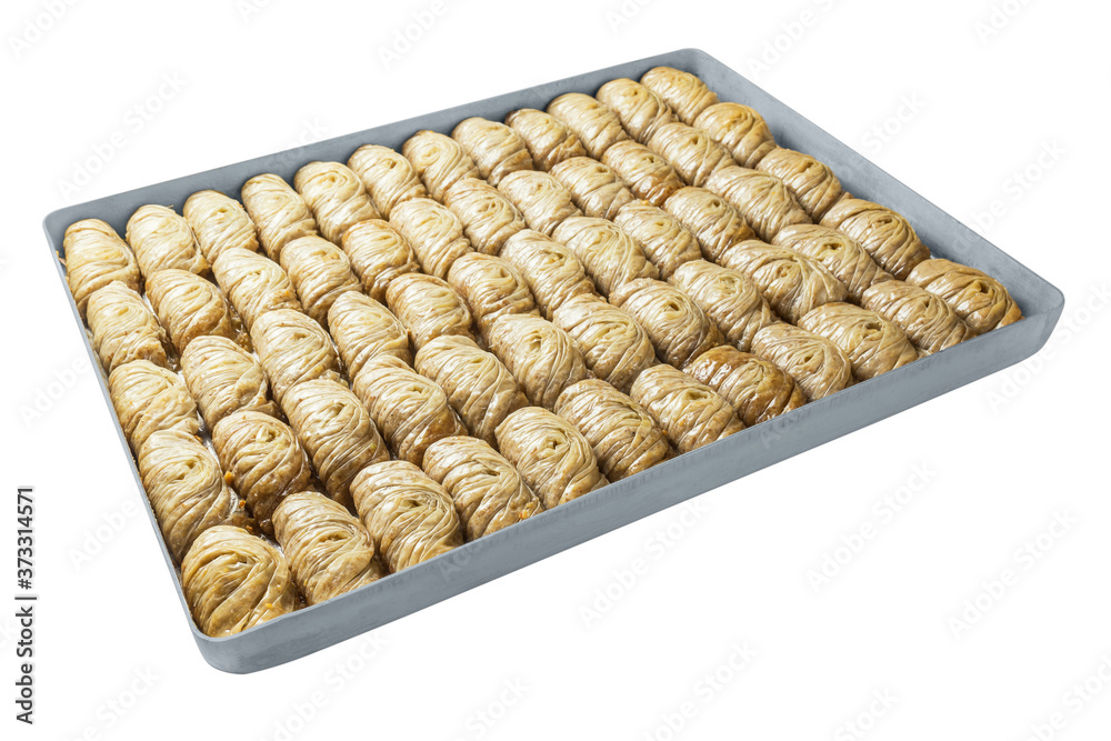 Turkish baklava, oriental sweets on a metal tray, isolated on white background. Horizontal format. Turkish baklava, oriental sweets on a metal tray, isolated on white background. Horizontal format.