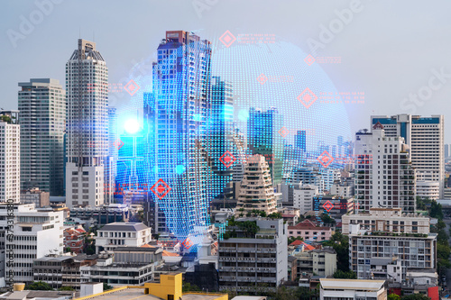 World planet Earth map hologram over panorama city view of Bangkok, Asia. The concept of international connections and business. Multi Exposure.