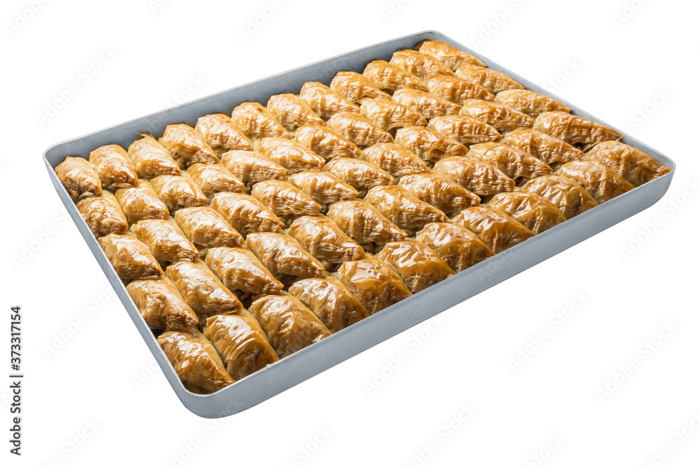 Turkish baklava, oriental sweets on a metal tray, isolated on white background. Horizontal format. Turkish baklava, oriental sweets on a metal tray, isolated on white background. Horizontal format.