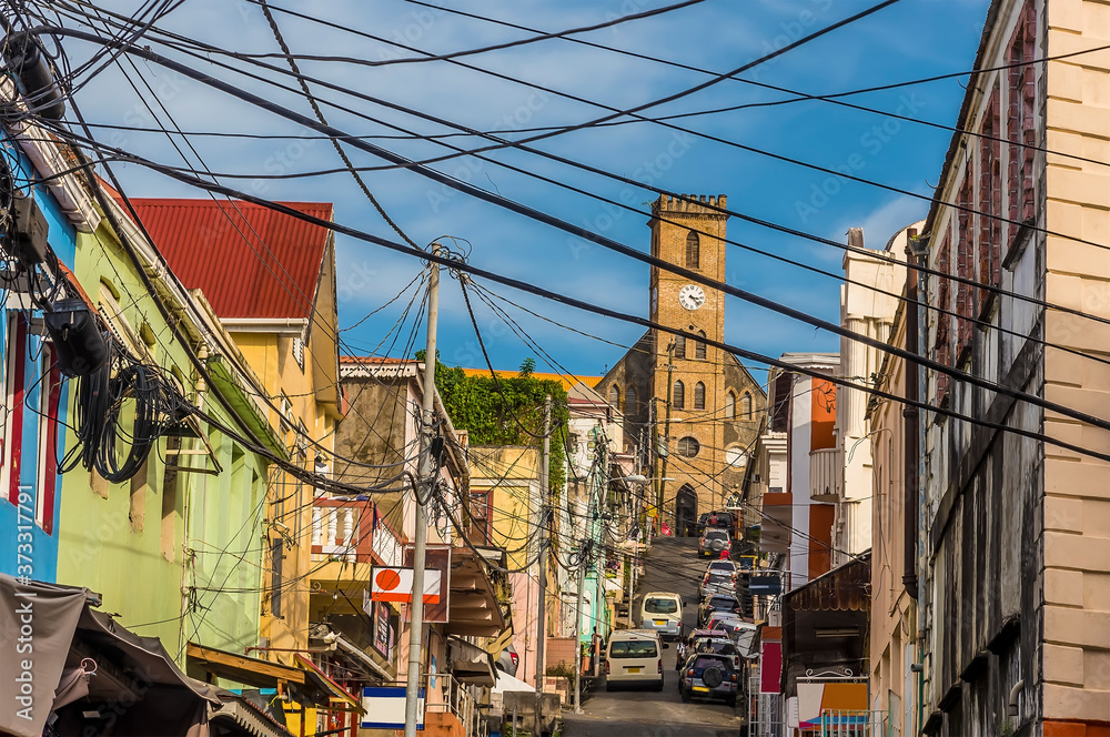 A street view across St Georges, Grenada towards the cathedral in the town