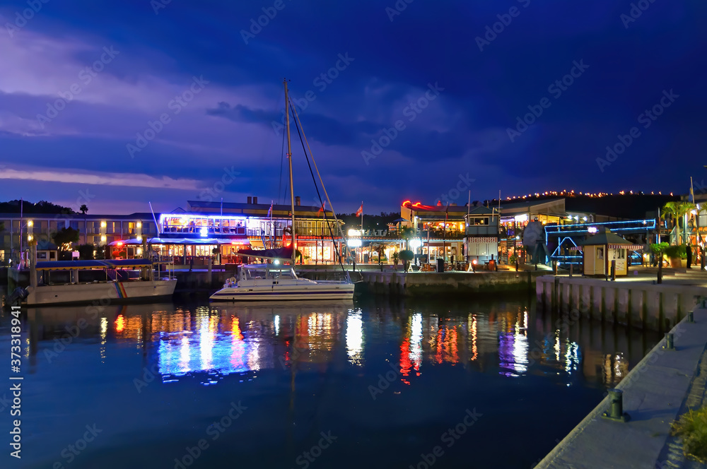 The Knysna Waterfront at Dusk, South Africa. Knysna is a town in the Western Cape Province of South Africa and is part of the Garden Route. The town is a popular destination for senior citizens 