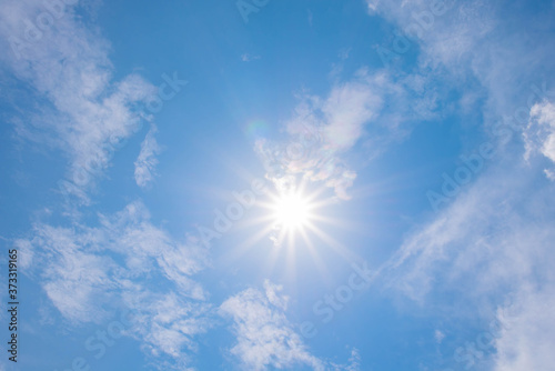 Beautiful shining sun at clear blue sky