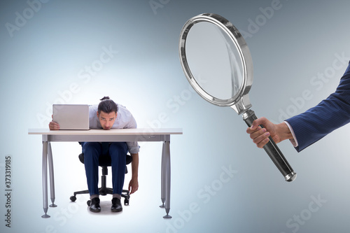 Concept of employee monitoring by boss photo