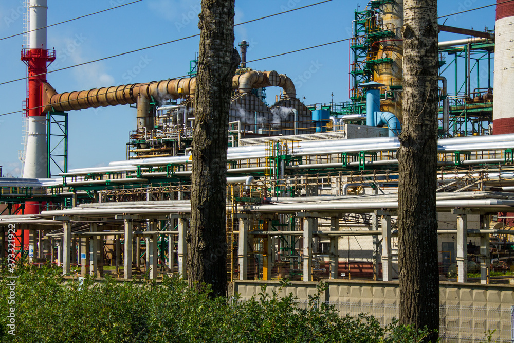 an oil refinery with industrial structures outdoors against a blue sky and space for copying in Yaroslavl Russia an oil refinery with industrial structures outdoors against a blue sky and space for copying in Yaroslavl Russia