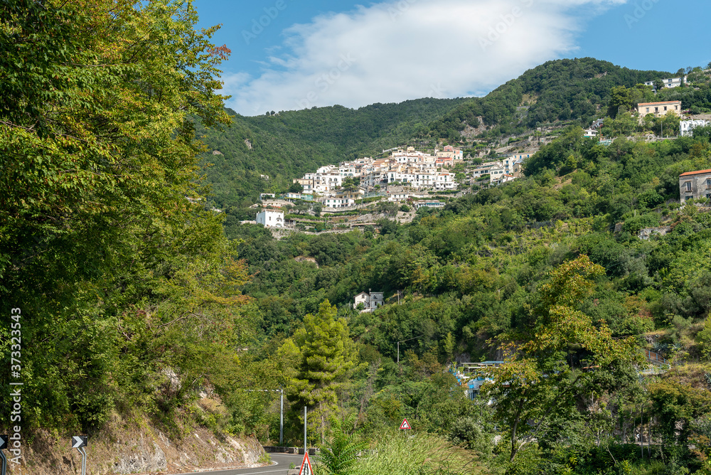 View of the inhabited area of Albori, a small village of Vietri sul Mare, seen from the Amalfi coast. View of the dome of the mother church.