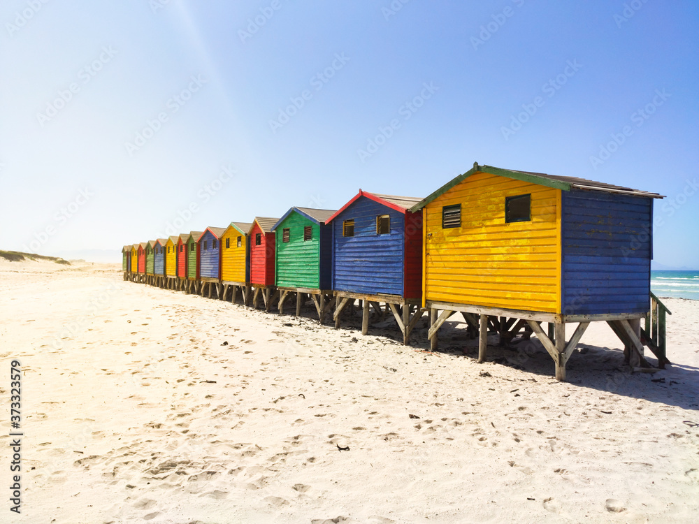 colorful beach houses on the beach at Muizenberg in side perspective - South Africa, Eastern Cape colorful beach houses on the beach at Muizenberg in side perspective - South Africa, Eastern Cape