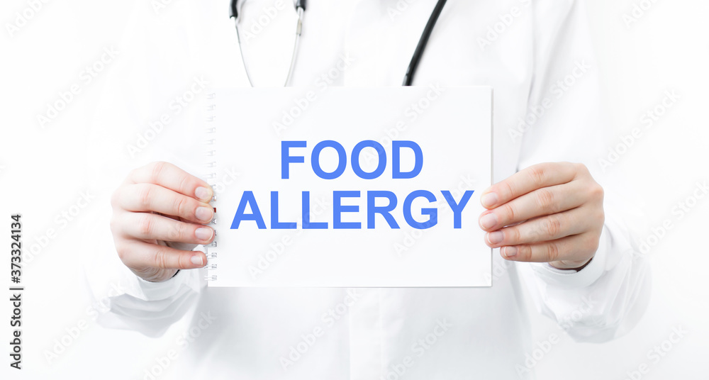 Doctor holding a card with text Food Allergy medical concept Doctor holding a card with text Food Allergy medical concept