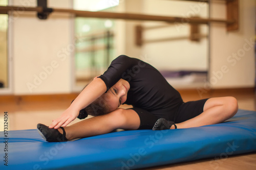 Kid at gymnastic class doing exercises. Children and sport concept