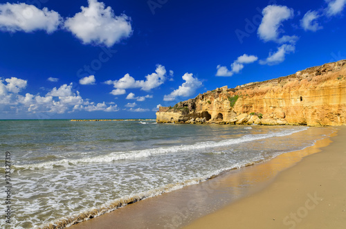 Mute Arch (Arco Muto) and the surrounding beach, sea and rocks. Anzio, Italy