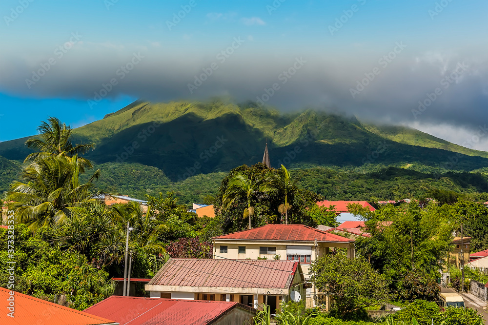 A panorama view across a settlement at the foot of the volcano, Mount Pelee in Martinique