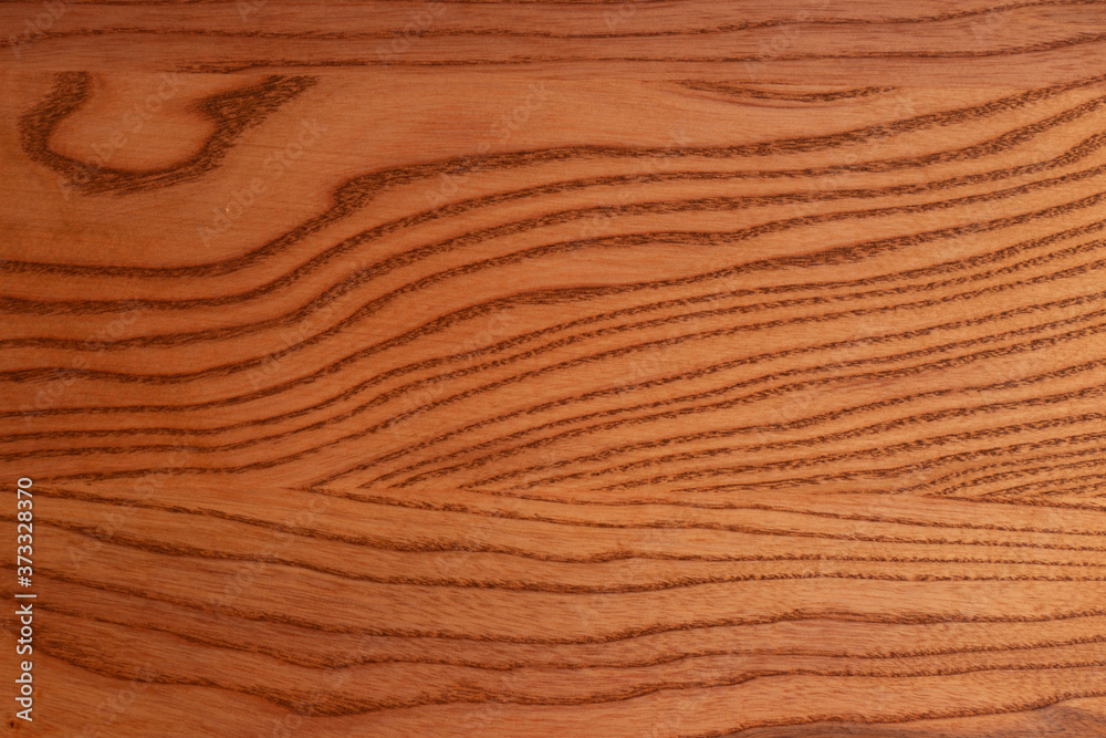 The structure of natural ash wood, tinted oak. Hardwood. Creative vintage background. Imitation of aging. The structure of natural ash wood, tinted oak. Hardwood. Creative vintage background. Imitation of aging.