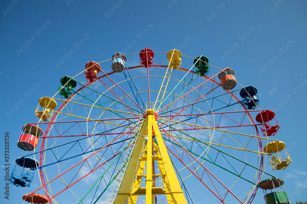 multi-colored ferris wheel.  recreation and entertainment