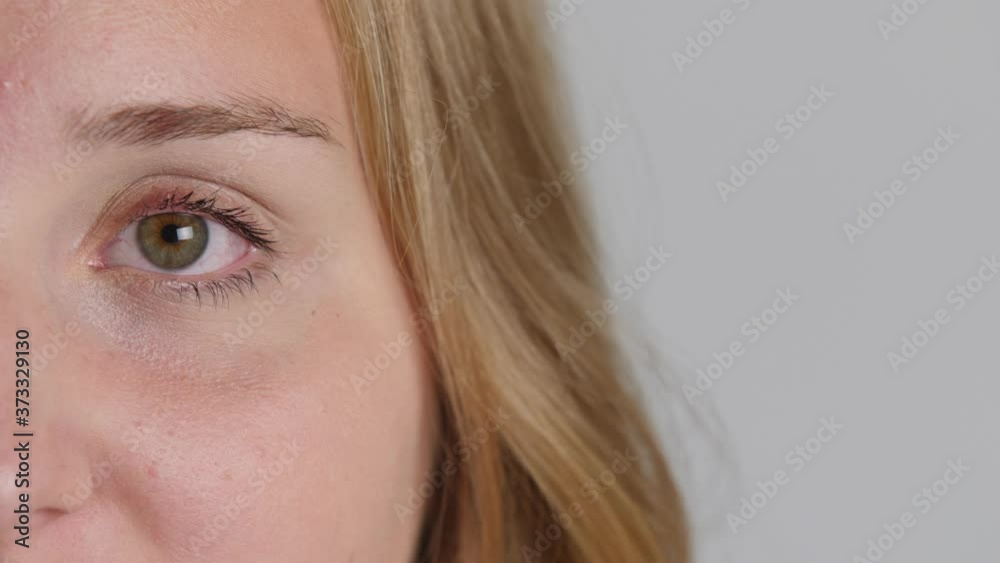 Attractive young blond caucasian woman laughs into camera with beautiful smile close-up 4k 50fps Attractive young blond caucasian woman laughs into camera with beautiful smile close-up 4k 50fps