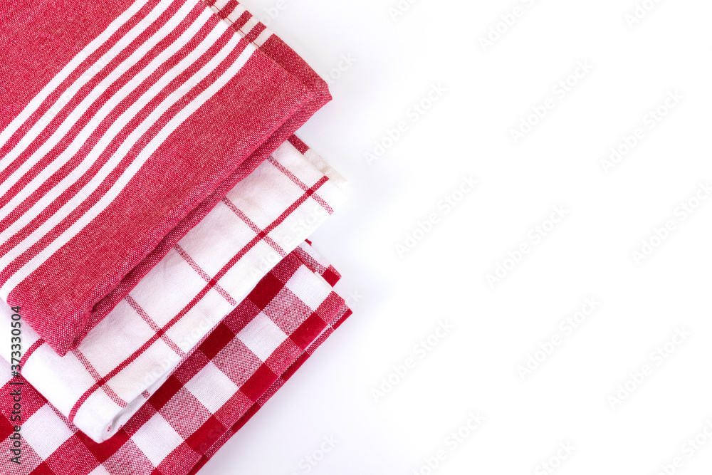Fototapeta premium Red checkered gingham kitchen towels top view on white with copy space