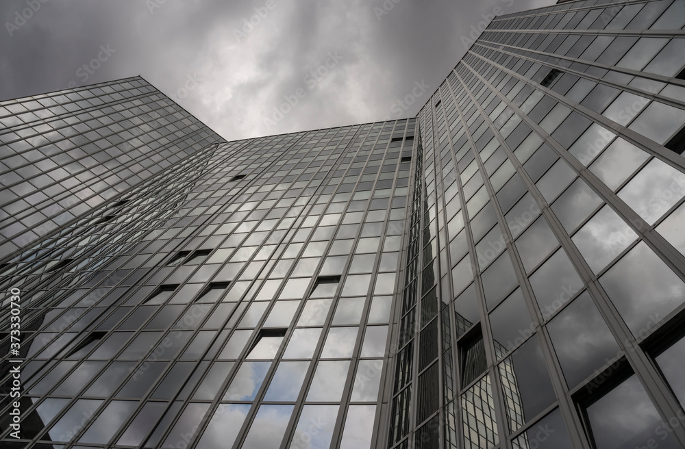 Fototapeta premium modern office building with storm clouds