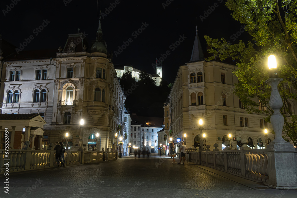 Old center of Ljubljana by night and the view at the castle