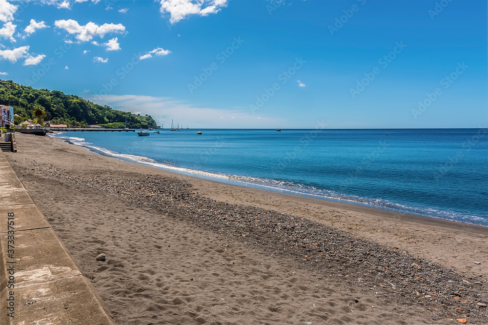 Fototapeta premium A view along the beach at Saint Pierre at the foot of the volcano, Mount Pelee in Martinique
