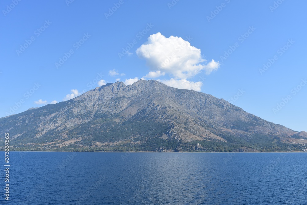 The rocky island. View of the island from the sea.  